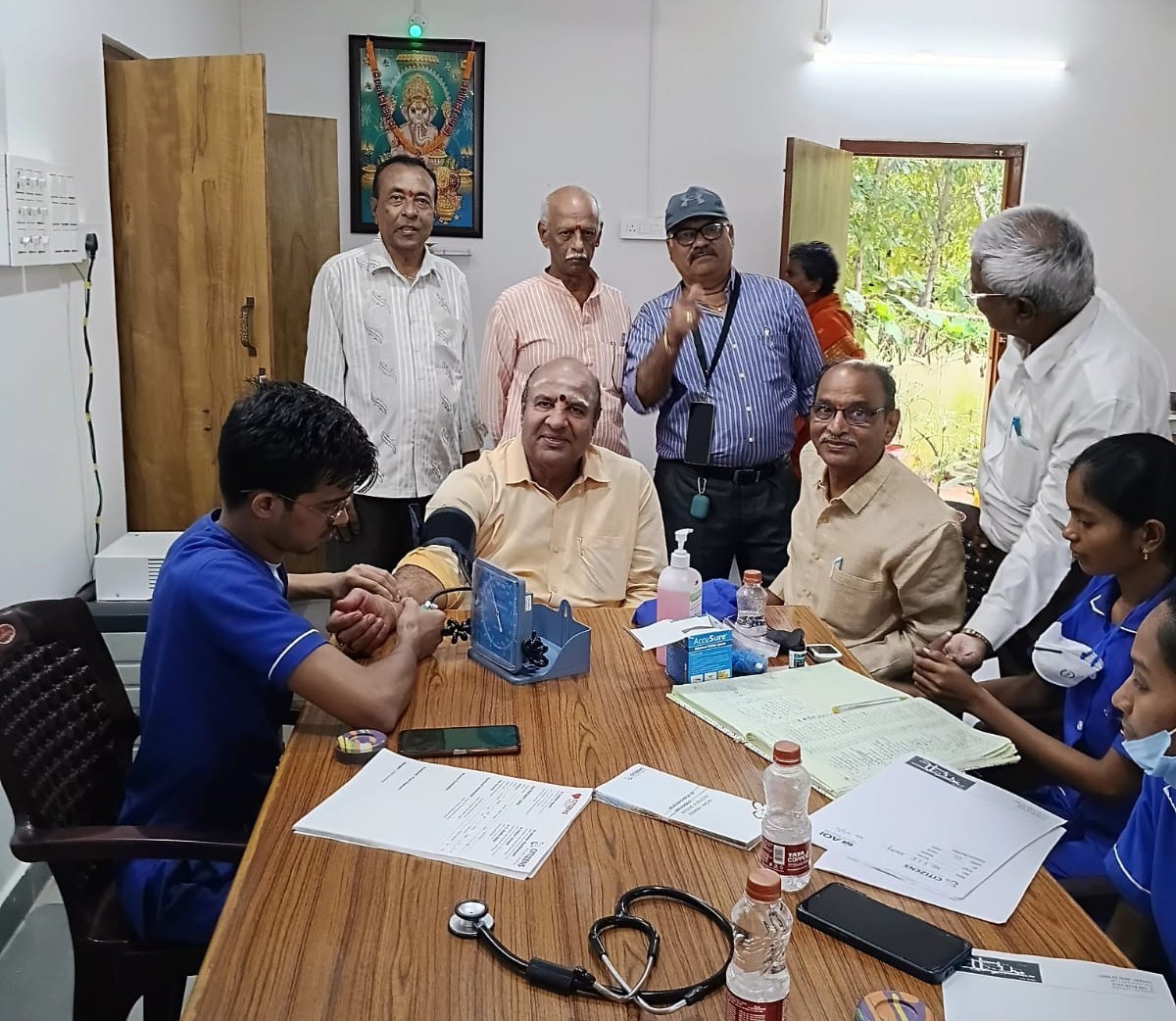 The Camp team testing BP for Siva Rama Chandra Murty Garu  in Senior Citizen Bhavan.jpg